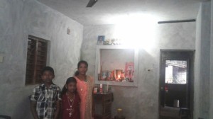 Nisha's house - AFTER the main room had its walls plastered and the floor laid with cement  